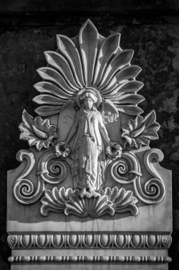 Stone relief of a woman on a german cemetery in Berlin 