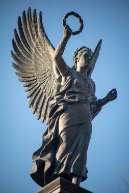 Stone statue of an angel on a german graveyard in Berlin
