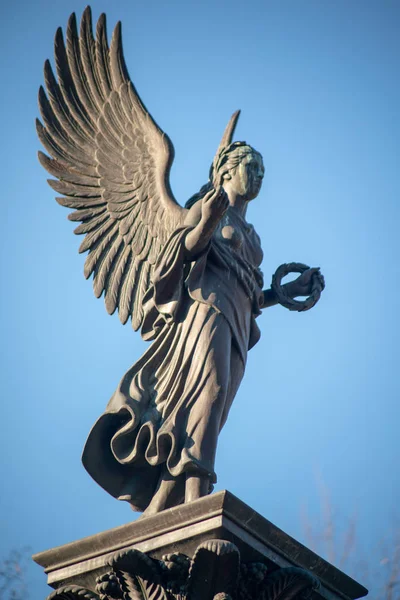 Stone statue of an angel on a german graveyard in Berlin