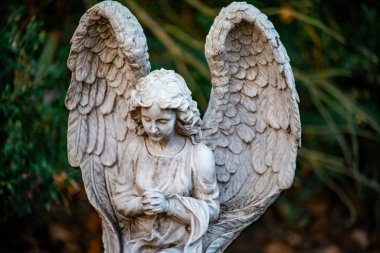 Statue of an angel on the graveyard Tegeler Fliess, Berlin, Germ