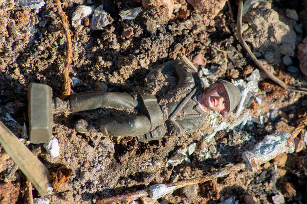 Abandoned toys - a childs toy soldier figure found as trash alon