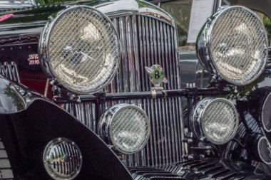 Welfenallee, Berlin, Germany - june 16, 2018: frontlamps on a vintage Bentley at the annual Oldtimer car meeting in Frohnau