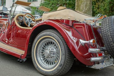 Welfenallee, Berlin, Germany - june 16, 2018: Details of a red Jaguar Oldtimer at the Vintage car meeting in Berlin