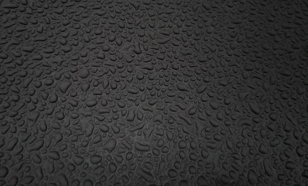 Prachtige achtergrond textuur van regenwater druppels op grijs zwart metalen oppervlak. Mooie achtergronden. Druppels water op een kleur achtergrond. Donkergrijs. — Stockfoto