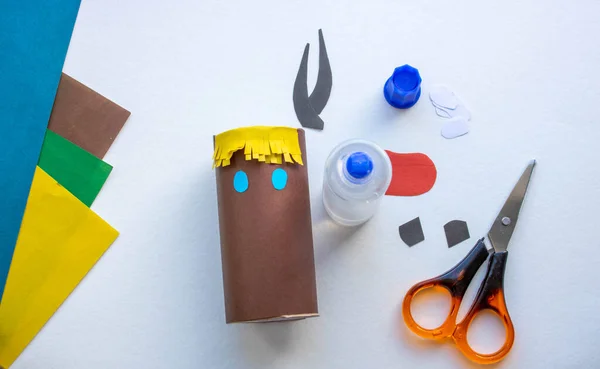 Step-by-step instructions. Step 4 Create a paper craft from a toilet sleeve. Brown bull. 2021.Chinese new year of the White Bull. Funny Halloween cute monster diy colored paper scissors glue. Children — Stock Photo, Image