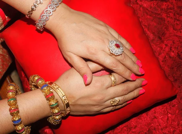 woman hands with ornaments and bangles