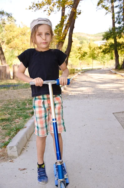 Kid boy on scooter — Stock Photo, Image