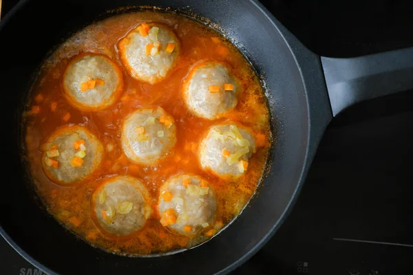 appetizing meatballs in a sauce stew in a pan