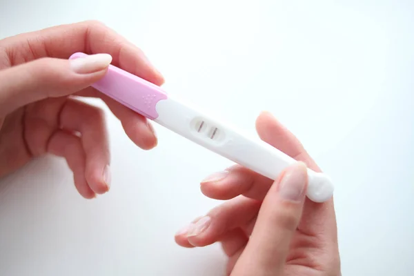 Woman holding on her hands pregnancy test. — Stock Photo, Image