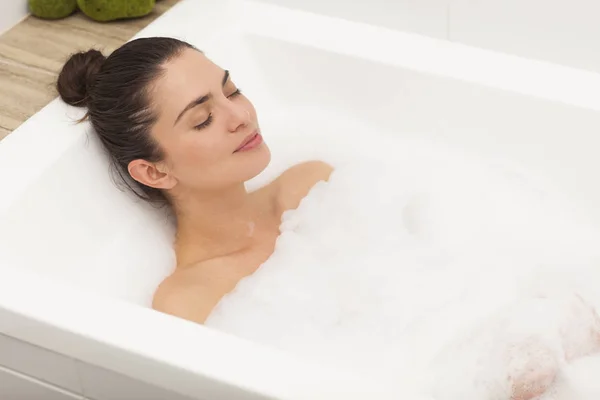 Beautiful woman taking a bath. — Stock Photo, Image