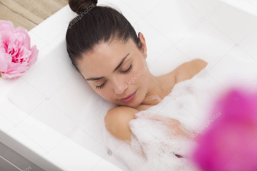 Beautiful woman taking a bath.