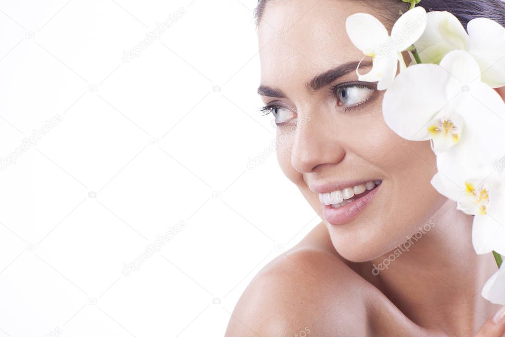 Beautiful fresh woman with orchid.