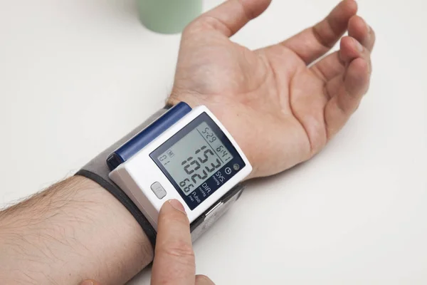 Man Examining Blood Pressure High Blood Pressure Stock Picture
