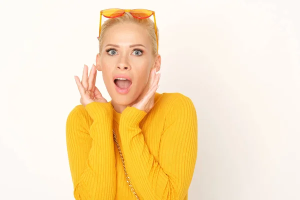 Blonde Woman Yellow Sweater Shocked — Stock Photo, Image