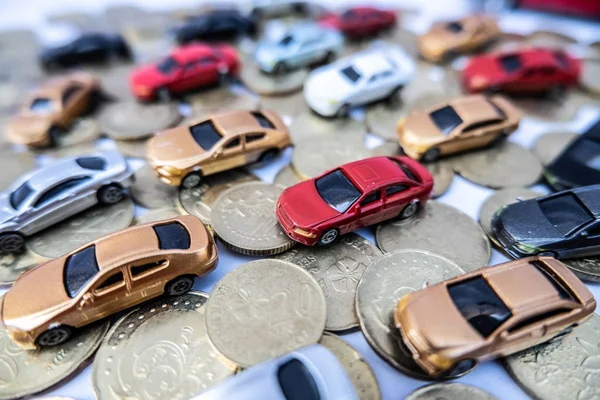 Toy cars with gold coins show To growth, saving money for car loans