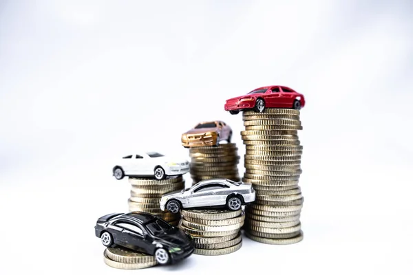 Toy cars with gold coins show To growth, saving money for car loans — Stock Photo, Image