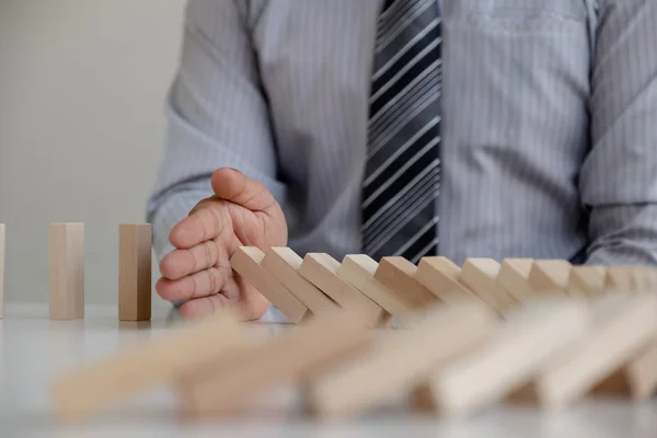 hand stop blocks wood game, gambling placing wooden block. Concept Risk of management and strategy plan, protect business to success