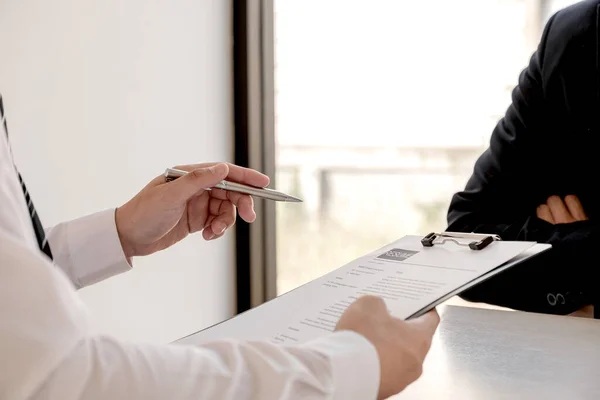 Business people hold a job profile and talk to job applicants for job interviews about careers and business concepts.