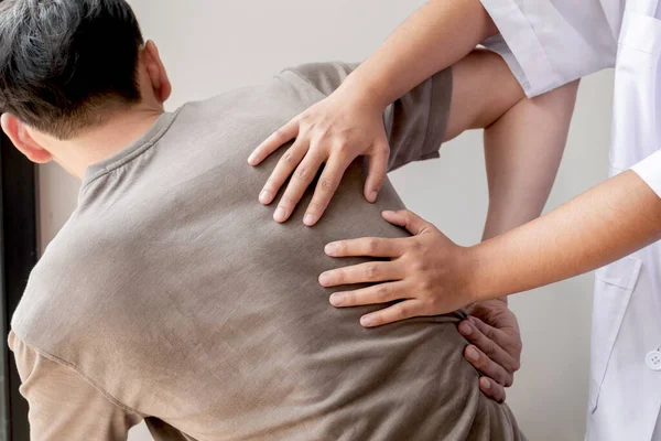 Female Physiotherapists Provide Physical Assistance Male Patients Back Injuries Back — Stock Photo, Image