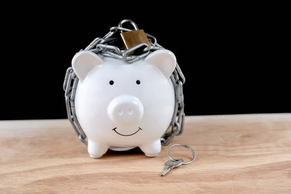 Chained piggy bank and lock money savings with chain and keys. Money security concept.