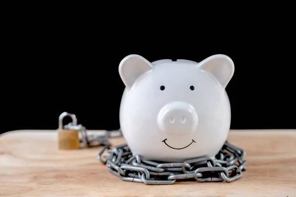 Chained piggy bank and lock money savings with chain and keys. Money security concept.
