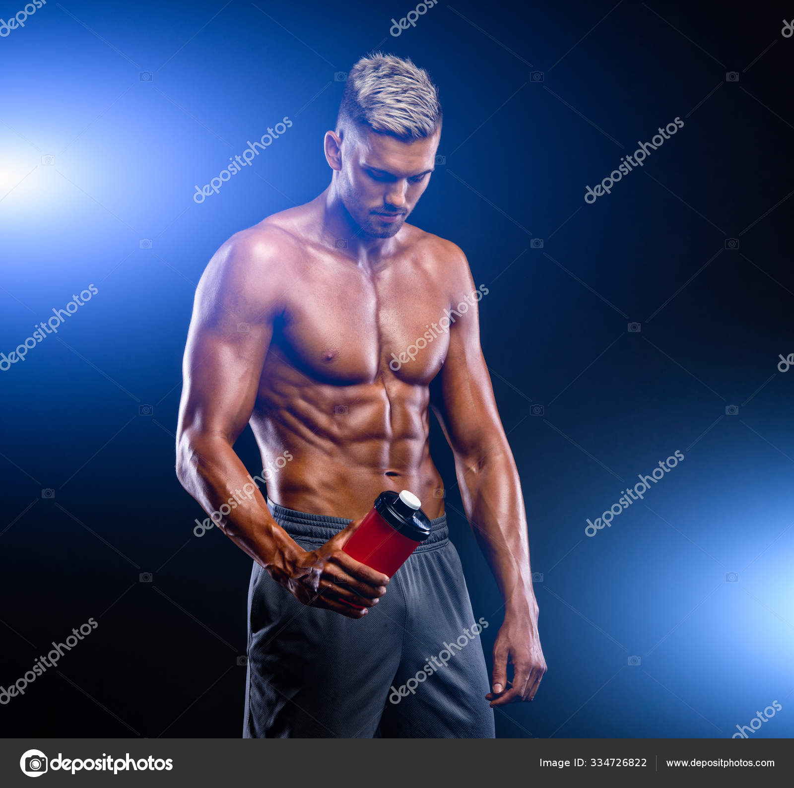 Nutritional Supplement. Muscular Men Drinks Protein, Energy Drink After