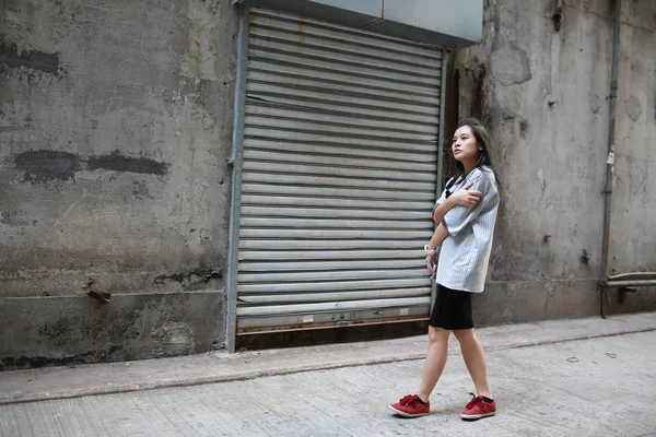 Girl with mood walk in the industry zone — Stock Photo, Image