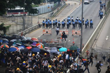 Hong Kong -12 June 2019: the crowd protest before and after police release tear gas. .people oppose a controversial extradition bill which may include china,  clipart