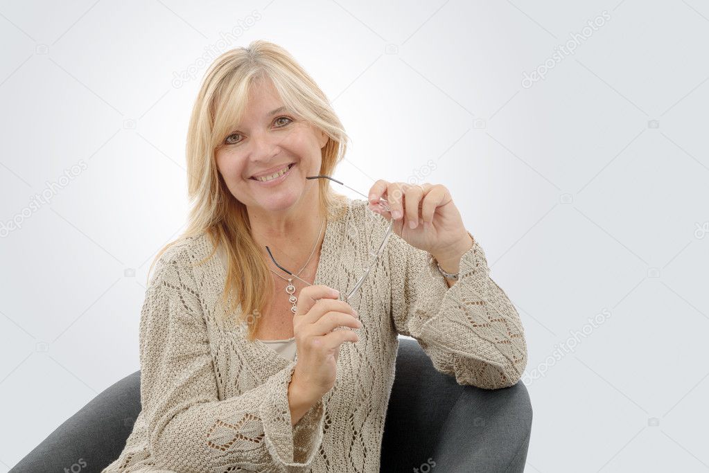 Portrait of mature smiling blond woman