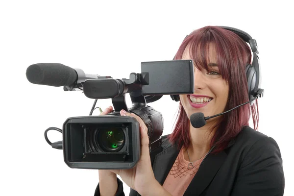 Mujer joven con una cámara de vídeo profesional — Foto de Stock