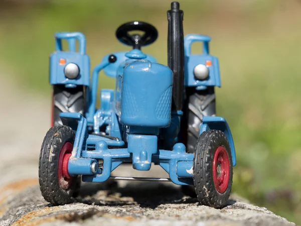 Scale model of blue farm tractor — Stock Photo, Image
