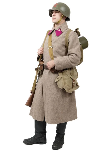 Young Soviet soldier with  winter uniform on the white backgroun — Stock Photo, Image