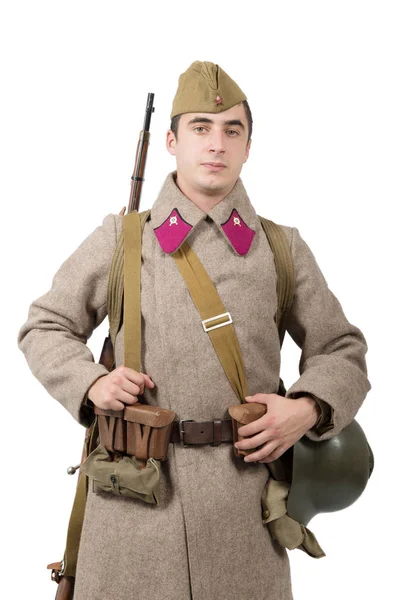 Junger sowjetischer Soldat mit Winteruniform auf weißem Hintergrund — Stockfoto