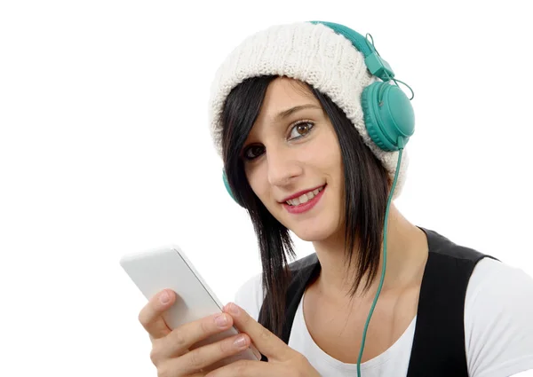 Young brunette listening to music with headphones and  phone — Stock Photo, Image