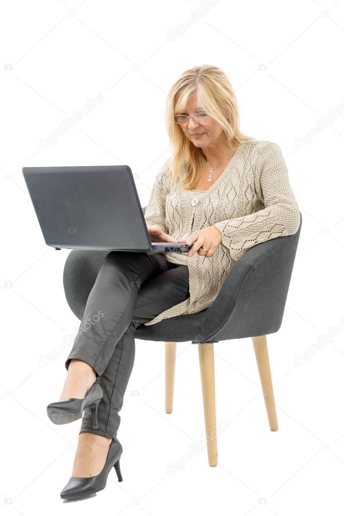 Portrait of a mature woman using laptop