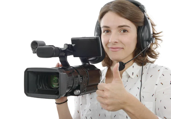 Genç ve güzel kız beyaz üzerine profesyonel video kamera ile — Stok fotoğraf