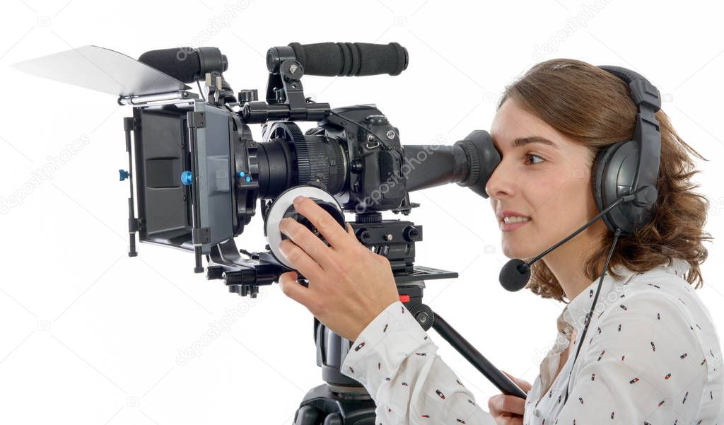beautiful young woman with SLR video camera