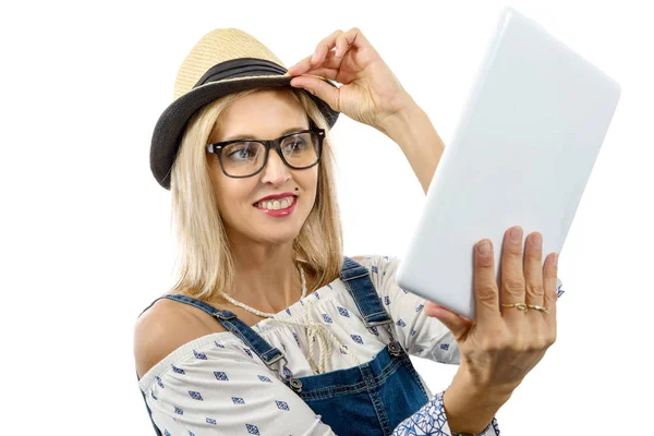 Blond middle-aged woman with tablet — Stock Photo, Image