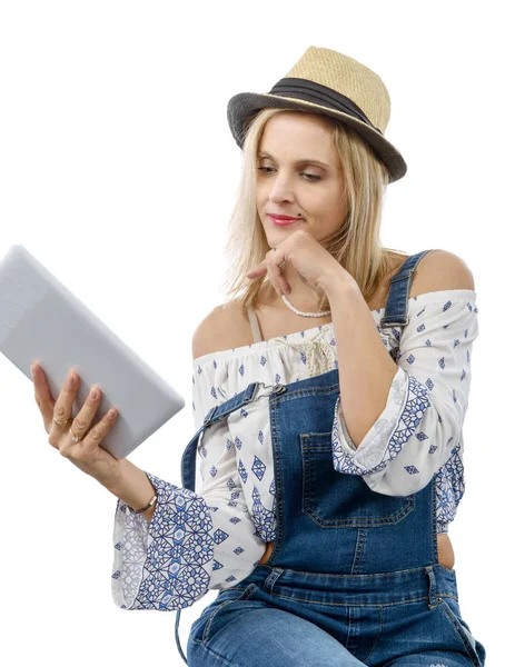 Blond middle-aged woman with tablet — Stock Photo, Image