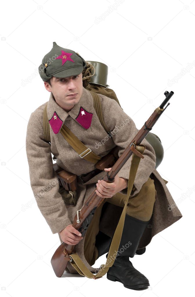 young Soviet soldier with  winter uniform on the white backgroun