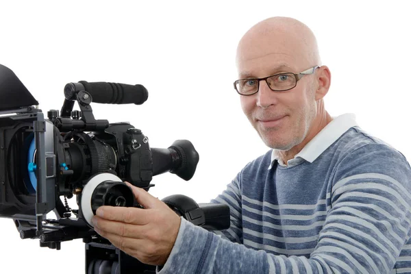 Pohledný muž s videokamera na bílém pozadí — Stock fotografie