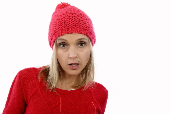 Beautiful young blonde woman with a red winter hat — Stock Photo, Image