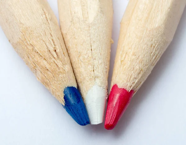 Three colored pencils, blue, white, red — Stock Photo, Image