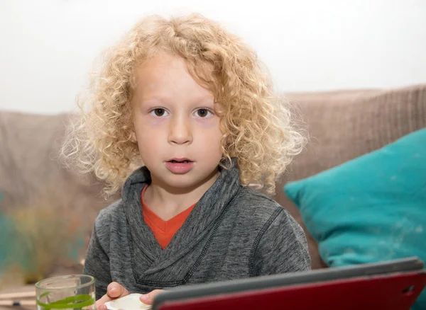 Little blond boy using tablet computer — Stock Photo, Image