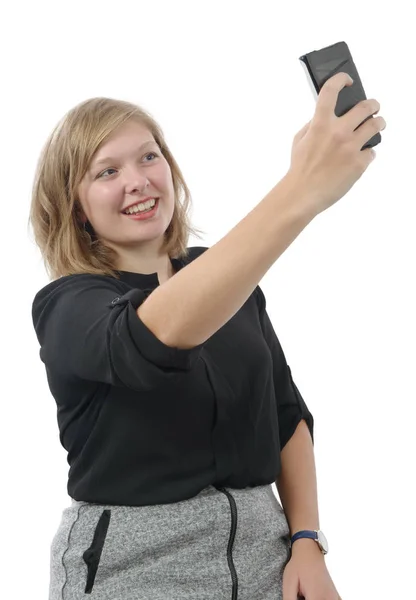 Ung kvinna med en telefon på vit — Stockfoto