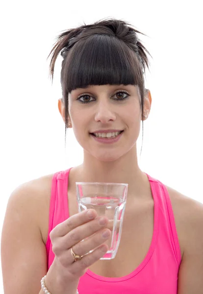 年轻女人喝一杯水，在白色 — 图库照片