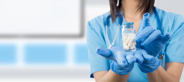 Doctor with pills in hand closeup — Stock Photo, Image