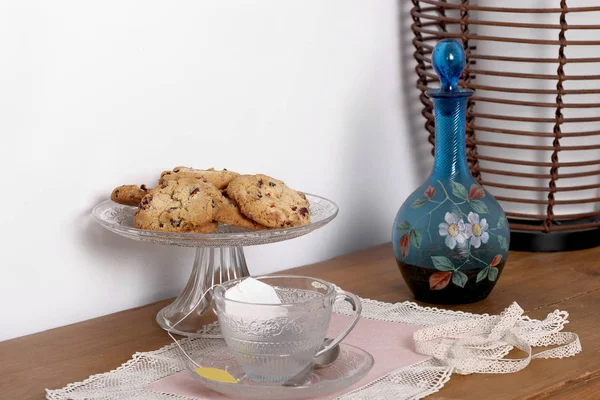 Cookies and jug on the wooden table — Stock Photo, Image