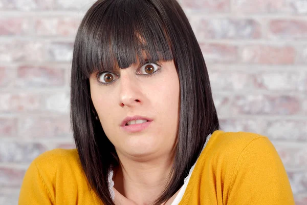 Beautiful casual brunette   woman is scared — Stock Photo, Image