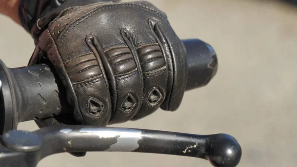 Human hand in a motorcycle gloves